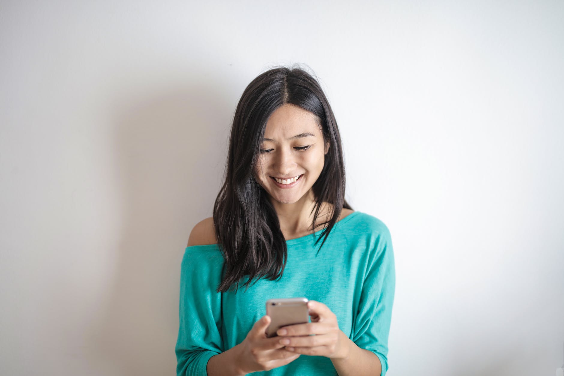 photo of woman using mobile phone